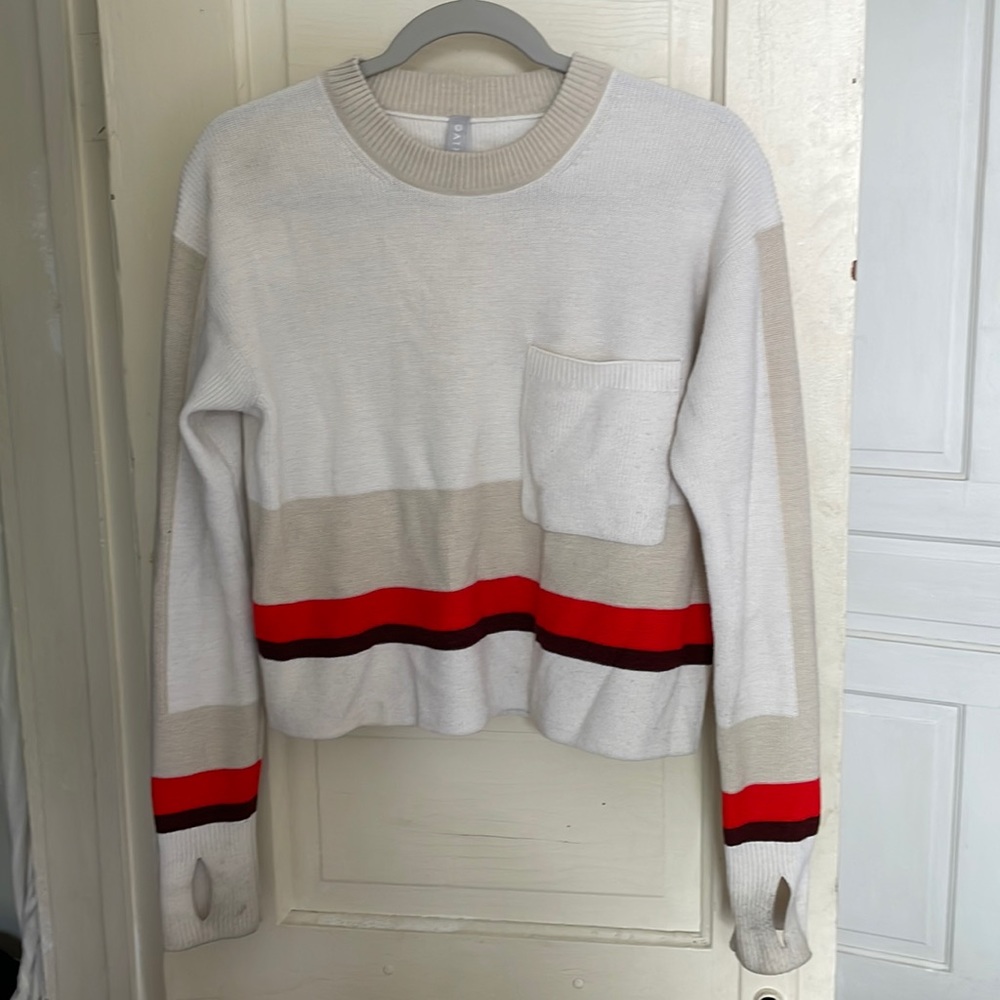 Athleta womens sweater. Striped with chest pocket and thumb holes